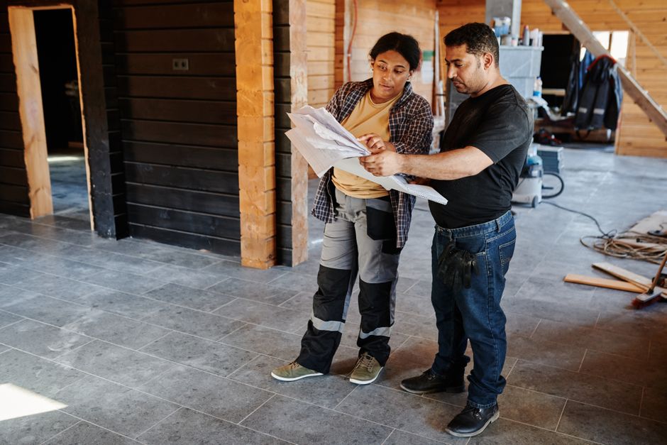 General contractor reviewing architectural blueprints