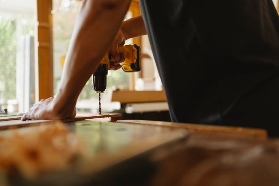 Skilled carpenter installing custom cabinets